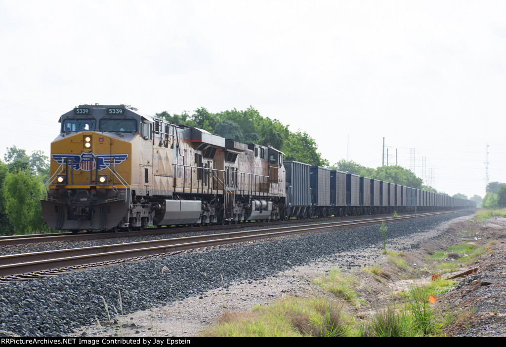 UP 5339 leads an empty rock train west on the Glidden Sub